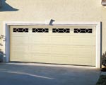 Wood garage doors can be finished to perfectly match the exterior of your home.